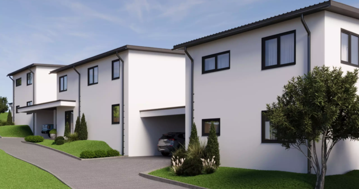 Moderne Außenansicht eines Neubauhauses mit Carport und geparktem Auto in Arnoldstein